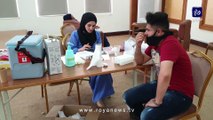مشاهد من حملة التطعيم ضد فيروس كورونا في الأردن الجمعة