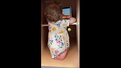 Toddler hides in kitchen cabinet to watch movie #Shorts