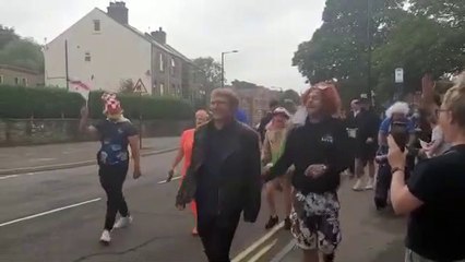 Fans march through Stocksbridge singing Vindaloo by Fat Les