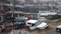 Cars washed away as heavy rainfall triggers flash flood