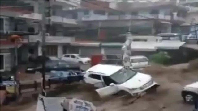 Cars washed away as heavy rainfall triggers flash flood