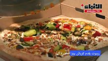 مطعم في قلب باريس يقدم للزبائن بيتزا محضرة آلياً على يد روبوت