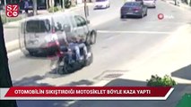 Otomobilin sıkıştırdığı motosikletlilerin kaza yaptığı anlar kamerada