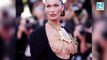 Bella Hadid sports statement lung necklace with risqué dress