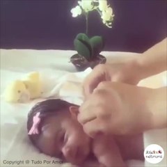 Cute baby enjoys a massage