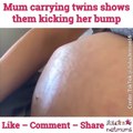Mum carrying twins shows them kicking her bump