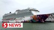 Singapore cruise ship turns back to port after suspected Covid-19 case