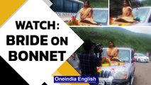 Pune: Bride on car bonnet flouts Covid rules for wedding shoot, police files case | Oneindia News
