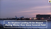 An Aero plane Landing At An Airport During Winter Over Snow Covered Field