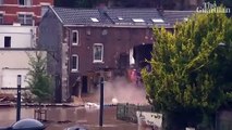 Belgian news crew capture moment flooded house partially collapses