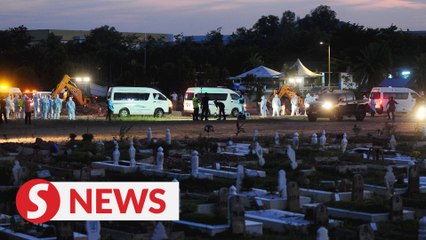 Sombre mood as remains of Covid-19 victims laid to rest