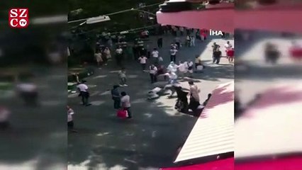 Öfkeli kadın eşini sokak ortasında darp eden genci tekme tokat dövdü