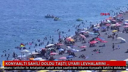 KONYAALTI SAHİLİ DOLDU TAŞTI; UYARI LEVHALARINI DİKKATE ALMAYIP TEHLİKELİ ATLAYIŞ YAPTILAR