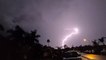Lightning flashes as thunderstorms illuminate the Southwest
