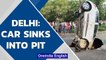 Delhi: Car sinks into pit that appeared after heavy rains in Dwarka | Oneindia News