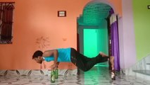 Guy Shows Impressive Balance Skills By Performing Pushups On Beer Bottles