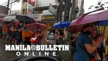Vaccination in Manila continues despite heavy rains, flooding