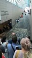 Passengers Flee as Flooding Flows Down Metro Stairs