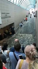 Passengers Flee as Flooding Flows Down Metro Stairs