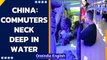 China: Metro commuters in neck deep water | Shocking videos emerge | Oneindia News