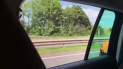 Watch the moment a reckless person threw a bottle out of speeding van - causing an £150k McLaren behind to dangerously swerve