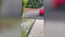 Hail stones the size of golf balls smash car windows and cause flash floods as Britain's barmy weather continues