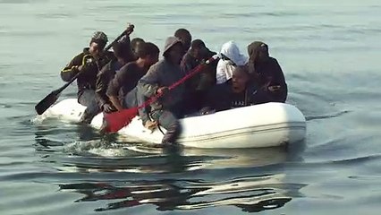 Group of men in small dinghy make journey from France