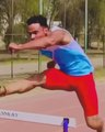 Guy Practices Jumping Over Hurdles While Running