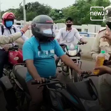 NGO Gives Free 500ml Petrol To Helmet And Mask Wearing Bikers