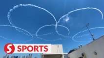 Japan's air force team flies over Tokyo Olympic Stadium