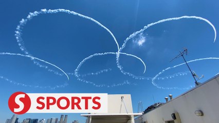 Japan's air force team flies over Tokyo Olympic Stadium
