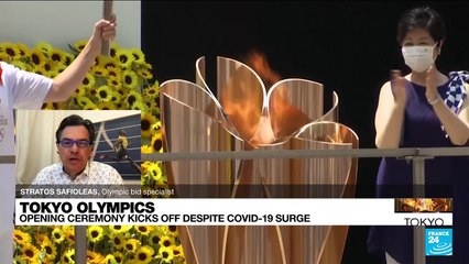 Pandemic-hit Tokyo Olympics open in low-key ceremony without fans