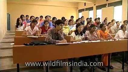 Attending lecture at Sri Venkateswara College