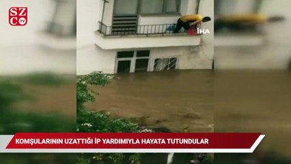Evleri suyla dolan çift komşularının uzattığı ip yardımıyla hayata tutundu