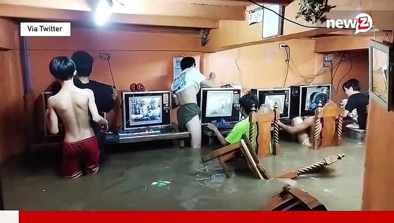 Online gaming addicts in cafe continue playing through typhoon flood