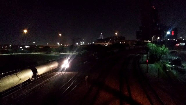 Burlington Northern Santa Fe Freight Train leads past Dallas Union Station with KCS Locomotive