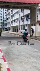 Man riding motorbike with child without helmet