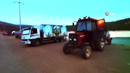 Köylüler helikoptere destek için tankerle sulama göledini doldurdu