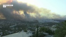 Incendies en Grèce: les images d'Athènes sous un important nuage de fumée