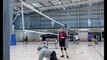 Woman Loses Balance and Falls While Spiking a Volleyball