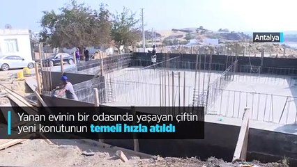 Yanan evinin bir odasında yaşayan çiftin yeni konutunun temeli hızla atıldı