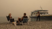 Wildfire evacuees take refuge on ship in Greece