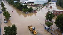 China cities declare rain 'red alerts' as flood death toll hits 21