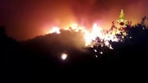 Fire fighters try to contain wildfires burning in the Monte Catillo nature reserve near Rome