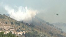 Wildfires rage amid record heat in Italy