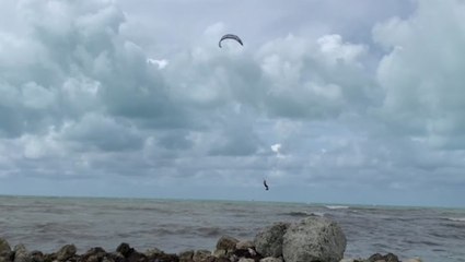 One brave soul kite surfs on Fred-churned waters