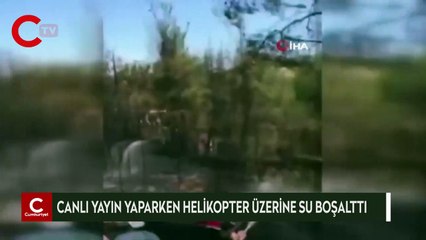 Canlı yayın yaparken helikopter üzerine su boşalttı