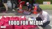 Media treated with food and drinks outside Istana Negara