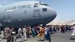 Afghans cling to departing US military plane as desperation grows at Kabul airport