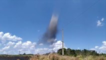 Dust devil swirls against beautiful skies in Brazil